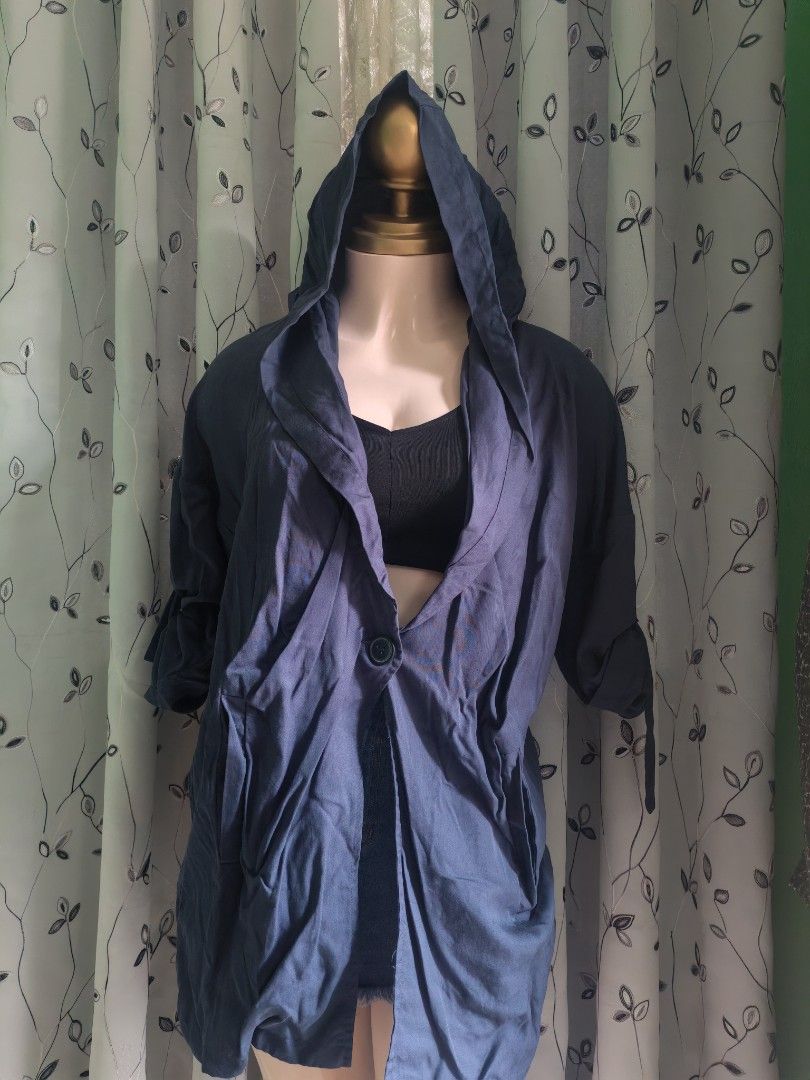 Navy Blue Hooded Cardigan Jacket with Single Button Closure (Category: Coats, Jackets and Outerwear) located in Caloocan City. Submitted by _misskaye (Listing ID 1467604339, Image 1). Description: - Color: Navy blue - Material: Lightweight and comfortable - Fit: Relaxed fit with long sleeves - Features: Hooded design, draped collar, single button closure, and front pockets - Styling: Great layering piece for casual outfits and chilly days.