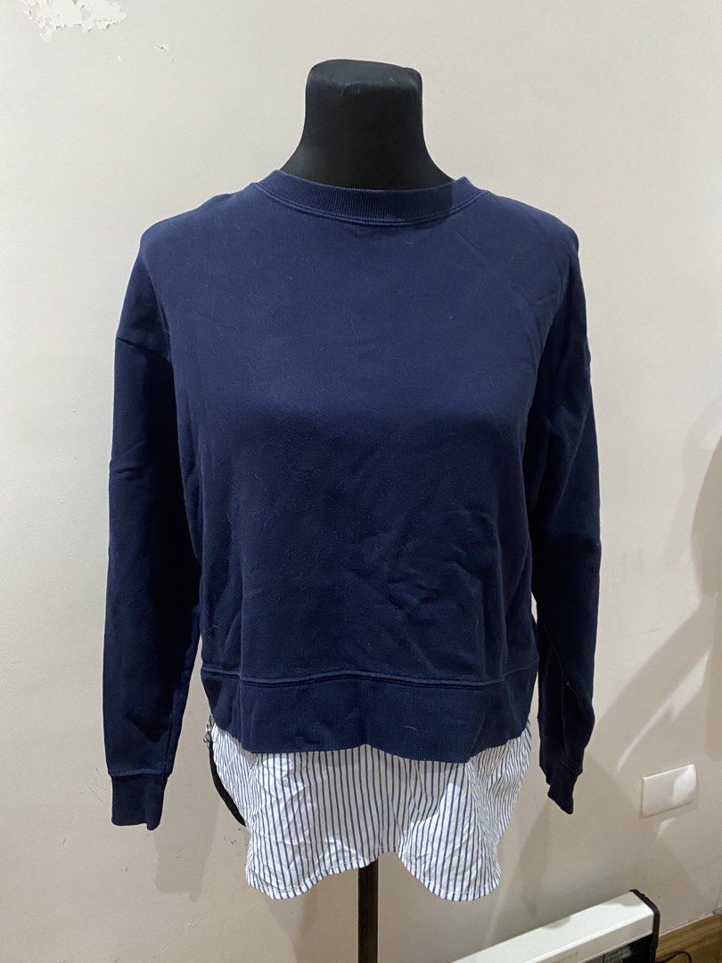 Navy Blue Sweatshirt with Striped Shirt Hem Layer (Category: Coats, Jackets and Outerwear) located in Manila. Submitted by mpt99876 (Listing ID 1467796055, Image 1). Description: - Color: Navy blue - Design: Crew neck sweatshirt with layered white and blue striped shirt hem - Features: Long sleeves and ribbed cuffs - Style: Casual, effortless layered look - Perfect for: Cooler days, paired easily with jeans or trousers.