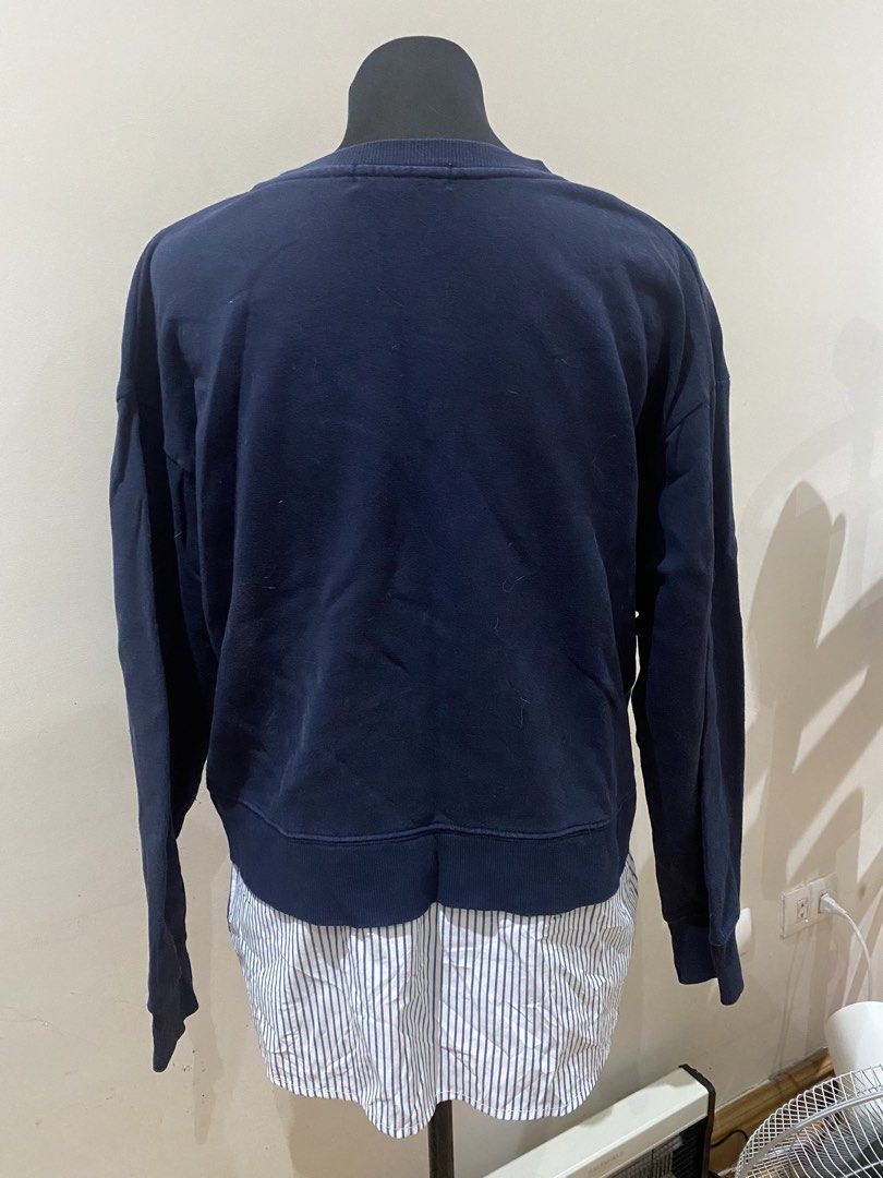 Navy Blue Sweatshirt with Striped Shirt Hem Layer (Category: Coats, Jackets and Outerwear) located in Manila. Submitted by mpt99876 (Listing ID 1467796055, Image 2). Description: - Color: Navy blue - Design: Crew neck sweatshirt with layered white and blue striped shirt hem - Features: Long sleeves and ribbed cuffs - Style: Casual, effortless layered look - Perfect for: Cooler days, paired easily with jeans or trousers.