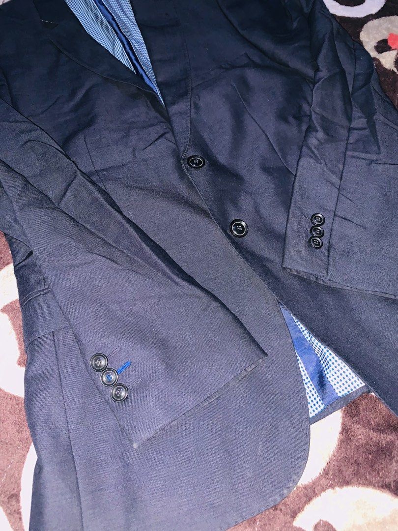 Navy Blue Zara Man Coat (Category: Coats, Jackets and Outerwear) located in Pasig City. Submitted by nyca1989 (Listing ID 1467767703, Image 2). Description: Navy blue men’s suit jacket or blazer with a two-button closure and a blue-and-white checked inner lining, featuring the “Zara Man” brand label near the collar. Medium Used once.