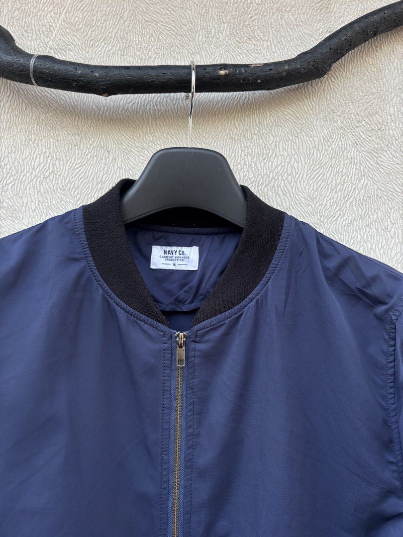 Navy Co Bomber Jacket (Category: Coats, Jackets and Outerwear) located in Baybay. Submitted by thrift.ed2023 (Listing ID 1467676391, Image 2). Description: Navy Co Bomber Jacket Medium 20x26 No Issue Need Wash Good as New.
