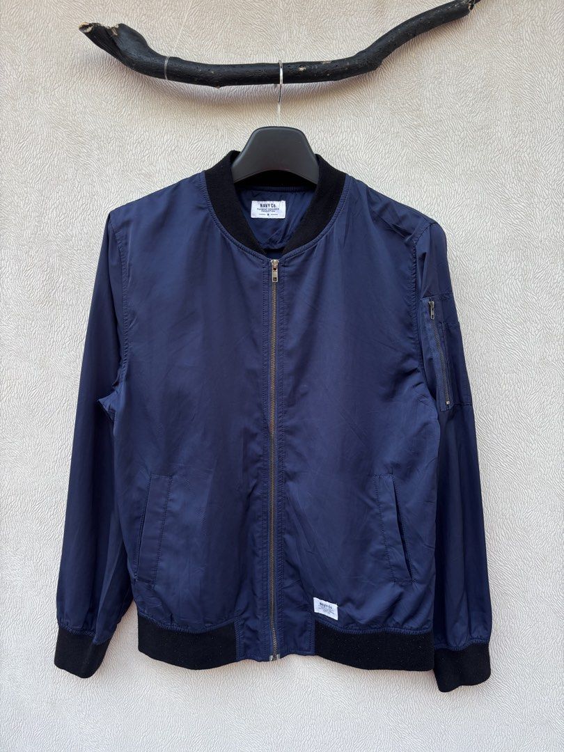Navy Co Bomber Jacket (Category: Coats, Jackets and Outerwear) located in Baybay. Submitted by thrift.ed2023 (Listing ID 1467676391, Image 1). Description: Navy Co Bomber Jacket Medium 20x26 No Issue Need Wash Good as New.