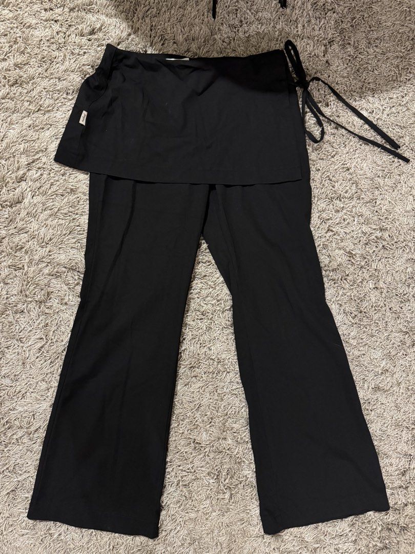 NAXED Black Skort Pants Size M (Category: Skirts) located in Caloocan City. Submitted by newcrystal_3b43ba (Listing ID 1467744244, Image 1). Description: - Color: Solid black - Size: Medium - Condition: Brand new with tag attached - Design: Pants with an attached wrap skirt overlay and side tie waist detail - Style: Versatile and chic, perfect for everyday wear.