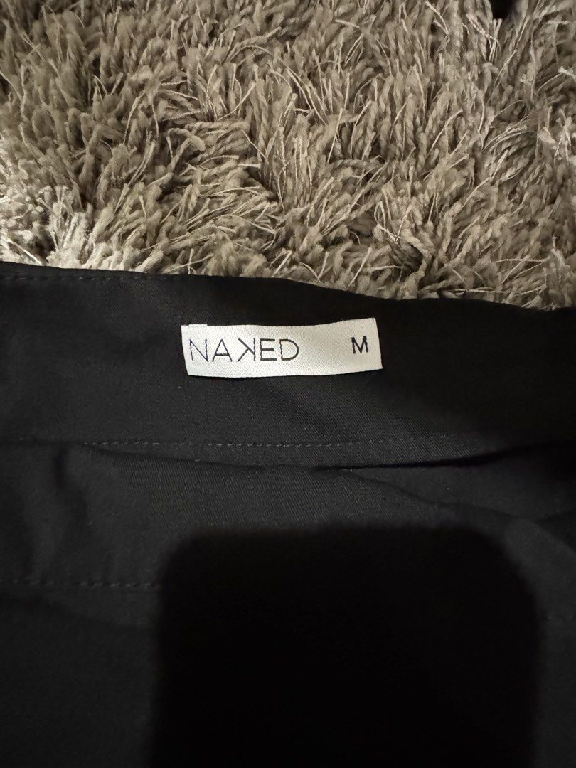NAXED Black Skort Pants Size M (Category: Skirts) located in Caloocan City. Submitted by newcrystal_3b43ba (Listing ID 1467744244, Image 2). Description: - Color: Solid black - Size: Medium - Condition: Brand new with tag attached - Design: Pants with an attached wrap skirt overlay and side tie waist detail - Style: Versatile and chic, perfect for everyday wear.