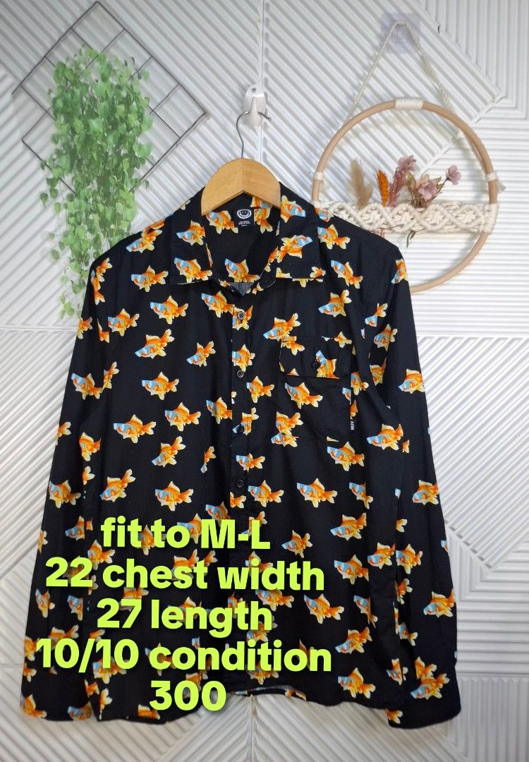 Neff Goldfish Print Long Sleeve Button Down Shirt (Category: Formal Shirts) located in Bulacan. Submitted by cathycampo51092 (Listing ID 1467727387, Image 2). Description: - Brand: Neff - Design: Vibrant goldfish graphics on black - Fit: Relaxed and comfortable - Features: Long sleeves, front button closure, and chest pocket with Neff tag - Style: Perfect statement piece for casual wear, streetwear, or parties.