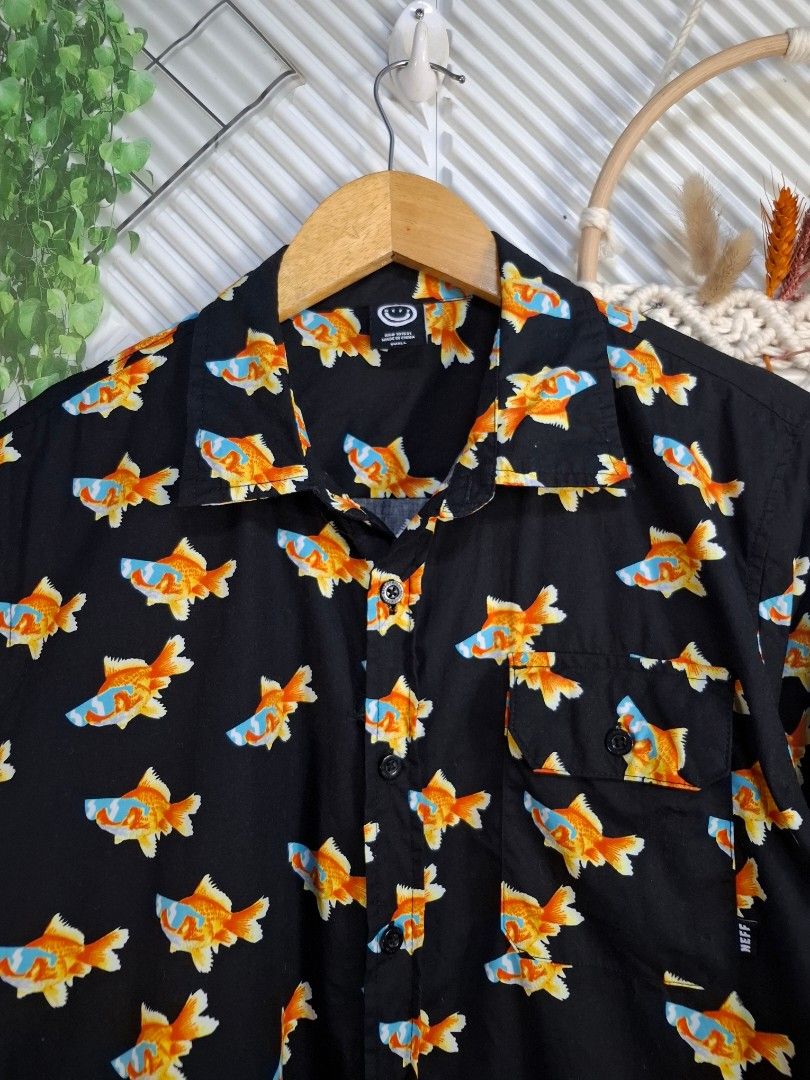 Neff Goldfish Print Long Sleeve Button Down Shirt (Category: Formal Shirts) located in Bulacan. Submitted by cathycampo51092 (Listing ID 1467727387, Image 1). Description: - Brand: Neff - Design: Vibrant goldfish graphics on black - Fit: Relaxed and comfortable - Features: Long sleeves, front button closure, and chest pocket with Neff tag - Style: Perfect statement piece for casual wear, streetwear, or parties.