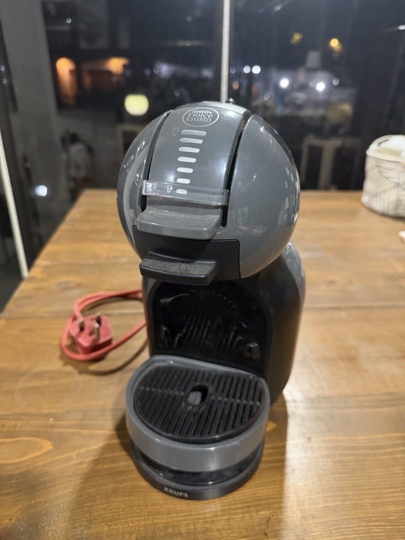 Nescafe Dolce Gusto Coffee Machine (Category: Coffee Machines & Makers) located in Marikina City. Submitted by lirawr (Listing ID 1467750192, Image 1). Description: - Model: Krups Nescafe Dolce Gusto Capsule Coffee Machine - Color: Sleek grey and black - Compatibility: Works with standard Dolce Gusto coffee pods - Features: Adjustable drip tray height and convenient top volume control lever - Design: Compact size, ideal for small kitchen counters