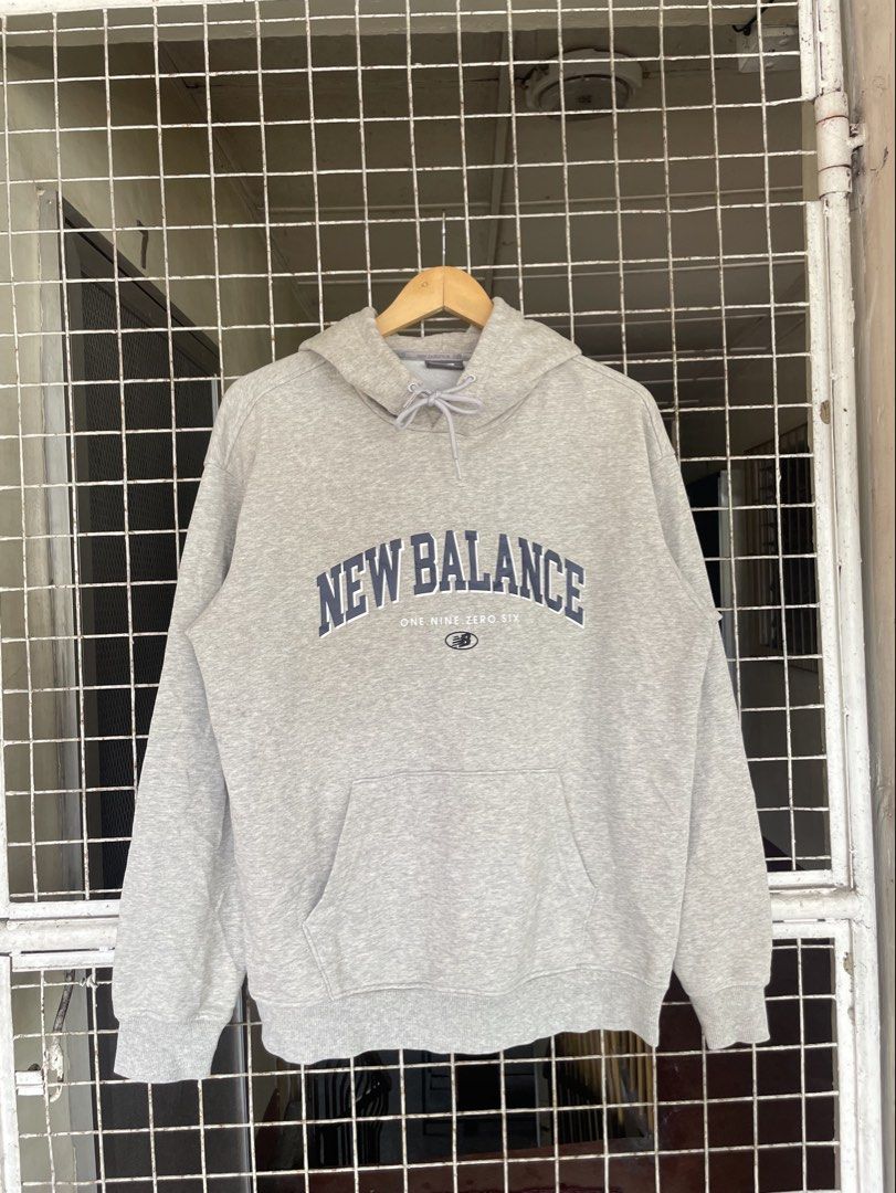 New Balance graphic pullover hoodie (Category: Coats, Jackets and Outerwear) located in Manila. Submitted by oftherack_04 (Listing ID 1467626833, Image 1). Description: New Balance graphic pullover hoodie featuring a collegiate-style arched logo and “ONE. NINE. ZERO. SIX.” text detail across the chest. Excellent condition No issue Size Large .