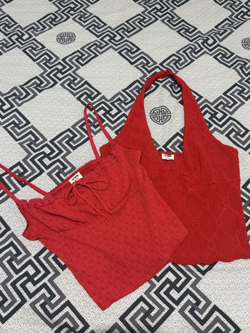 NEW Cotton On Red Tops Bundle Size M (Category: Sleeveless) located in Valenzuela. Submitted by ellapsl (Listing ID 1467726297, Image 1). Description: - Brand: Cotton On - Size: Medium (M) - Quantity: Set of 2 red tops - Piece 1: Spaghetti strap cami with tie-front string and delicate lace trim - Piece 2: Halter neck top featuring an all-over eyelet diamond pattern - Condition: Brand new with clear brand tags attached inside - Style: Versatile wa