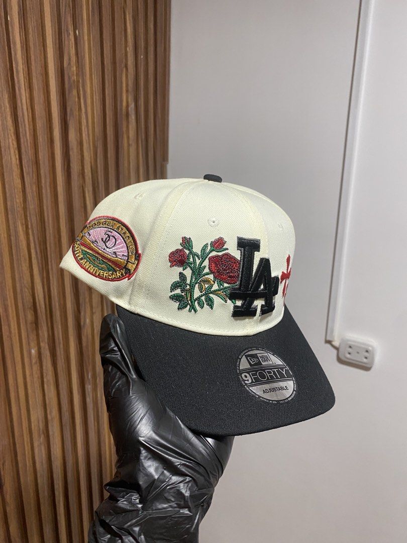 New Era LA Dodgers 9FORTY Rose Adjustable Snapback Cap (Category: Caps & Hats) located in Caloocan City. Submitted by heatedcaps4425 (Listing ID 1467801880, Image 2). Description: - Brand: New Era 9FORTY Snapback - Color: Off-white and black - Design: LA Dodgers front logo with embroidered red roses and crosses - Special Feature: Unique side patch on the right panel - Fit: Adjustable plastic strap at the back - Condition: Brand new with original 