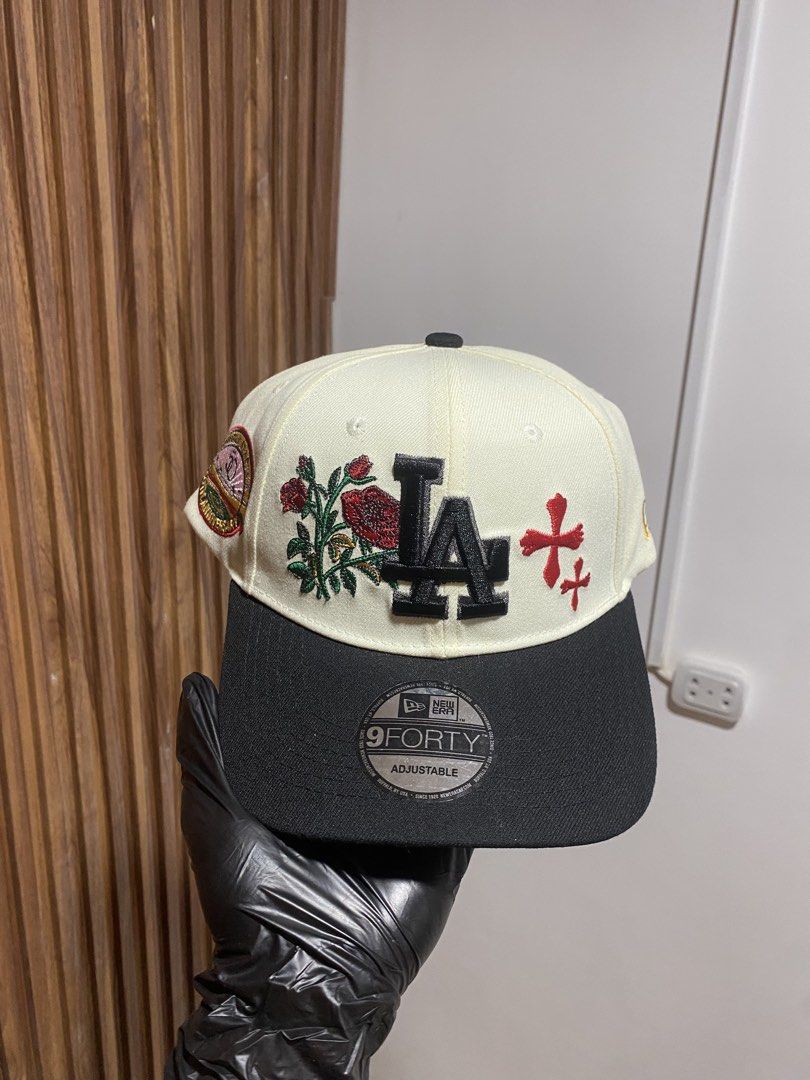 New Era LA Dodgers 9FORTY Rose Adjustable Snapback Cap (Category: Caps & Hats) located in Caloocan City. Submitted by heatedcaps4425 (Listing ID 1467801880, Image 1). Description: - Brand: New Era 9FORTY Snapback - Color: Off-white and black - Design: LA Dodgers front logo with embroidered red roses and crosses - Special Feature: Unique side patch on the right panel - Fit: Adjustable plastic strap at the back - Condition: Brand new with original 