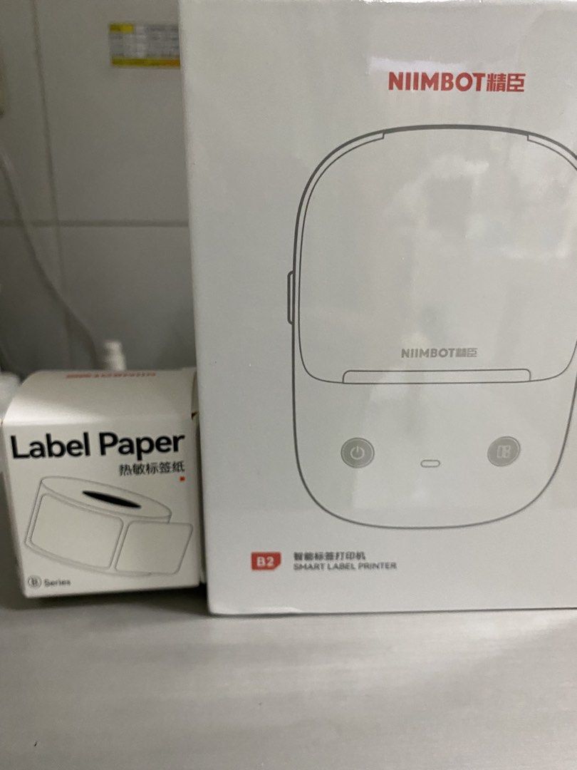 NIIMBOT B2 Smart Label Printer with Label Paper (Category: Printers, Scanners & Copiers) located in Las Pinas. Submitted by elyag05 (Listing ID 1467667912, Image 2). Description: -Light Sand - Brand new, sealed in box NIIMBOT B2 smart label printer - Includes an extra roll of label paper 40x30 - Seamless Bluetooth connectivity supporting both iOS and Android - Built-in 1500mAh rechargeable battery - Perfect for home organization, small business, 