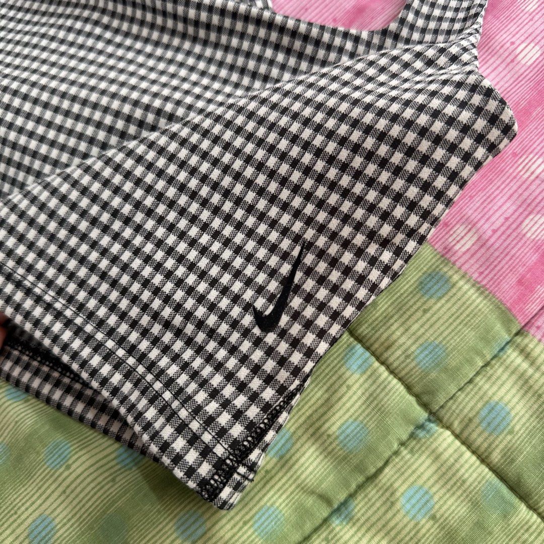 Nike - Yoga Cropped Gingham Tank Top (Category: Activewear) located in Muntinlupa City. Submitted by pickjes (Listing ID 1467753574, Image 2). Description: 100% Authentic Nike Size: Medium in tag but runs small. Measurements posted. Details: not padded but has lining Condition: Like new, used only once. No flaws. Rfs: no longer fits me Dri-FIT - Technology helps to keep you feeling dry and comfortable. Minimal Sewing Lines - Create a smooth silho