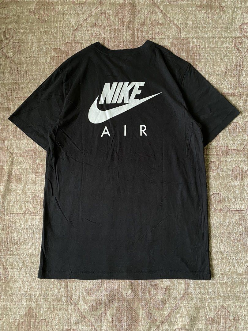 Nike Air Black T-Shirt (Category: Tshirts & Polo Shirts ) located in Manila. Submitted by diporosmoh43681 (Listing ID 1467733411, Image 2). Description: - Brand: Nike - Style: Nike Air Short Sleeve Tee - Color: Black with white graphics - Details: White Nike Air chest print, smaller logo on left shoulder, right chest patch, and large Nike Air back print - Fit: Crew neck, standard fit - Authenticity: Includes 'The Nike Tee' inner collar label - Co