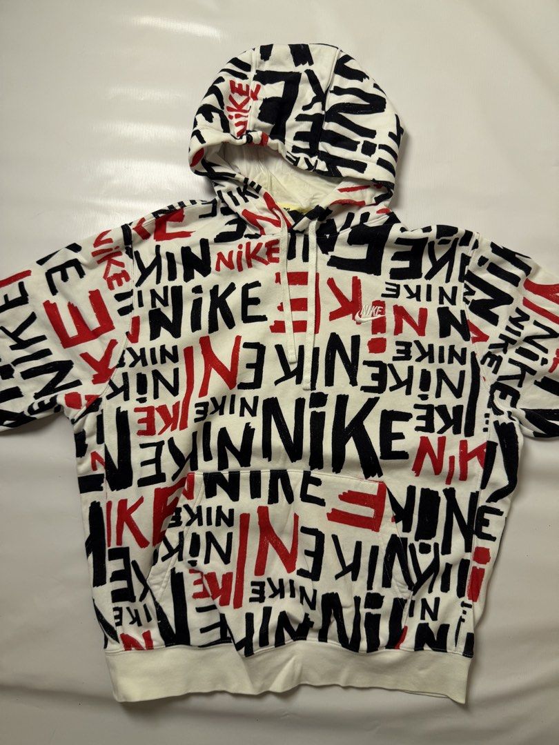 Nike All-Over Print Logo Hoodie (Category: Hoodies) located in Gapan. Submitted by rasthriftshop (Listing ID 1467804564, Image 1). Description: NIKE Aop Size on tag: XL Dimes: 24 x 28 ₱800 + sf Condition: Excellent Color rate: 9/10 Issue: None.