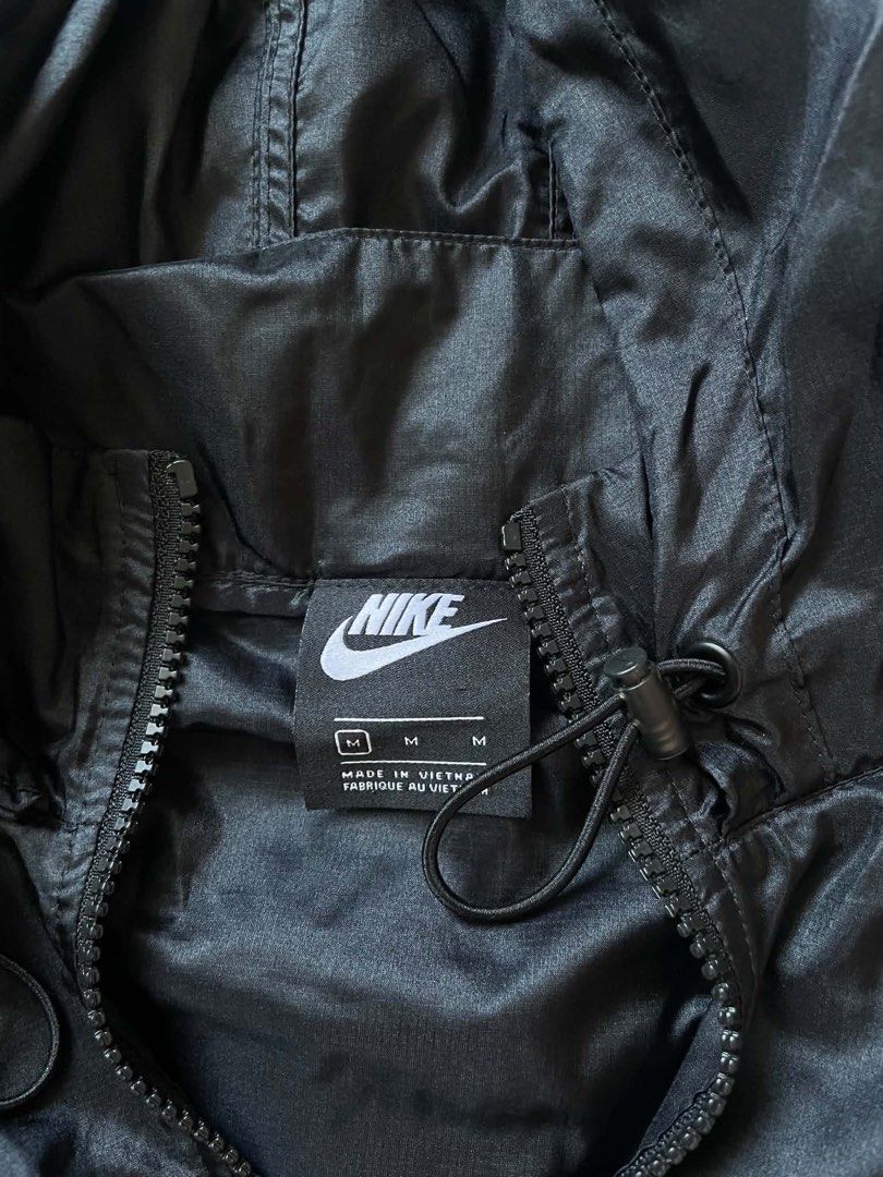 Nike Black Nylon Hooded Windrunner Jacket Size M (Category: Coats, Jackets and Outerwear) located in Manila. Submitted by rewornthrifts (Listing ID 1467668964, Image 3). Description: - Brand: Nike - Type: Hooded Windbreaker - Size: Medium (M) - Color: Black with white embroidered logo - Material: 100% lightweight nylon (Made in Vietnam) - Features: Full zip front, adjustable drawstring hood, waist cinch - Condition: Clean and ready to wear - Perf