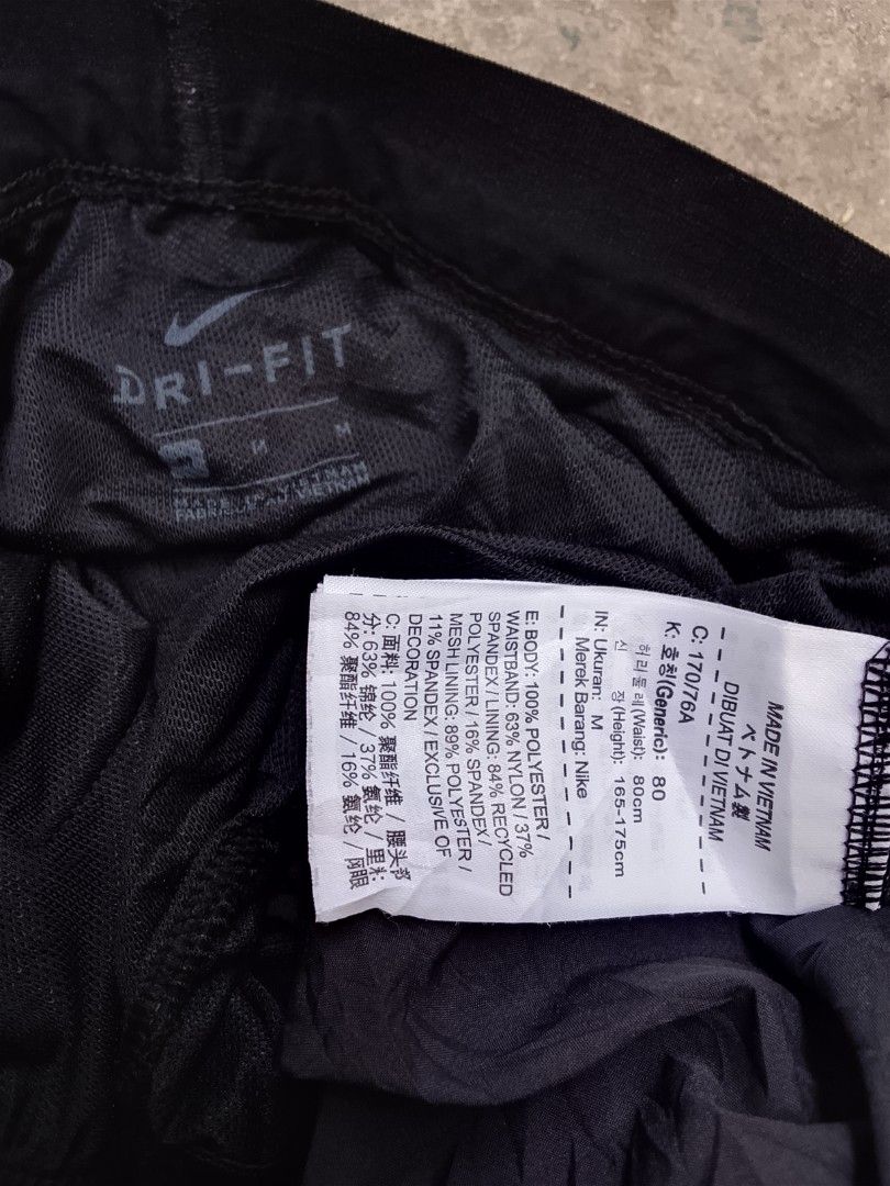 Nike Dri-FIT Black Athletic Shorts Size M (Category: Shorts) located in Las Pinas. Submitted by solisjethr46316 (Listing ID 1467747285, Image 2). Description: - Brand: Nike - Style: Dri-FIT Men's Shorts - Color: Black - Size: Medium (Waist: 80cm, Fits Height: 165-175cm) - Material: 100% polyester body with nylon/spandex waistband - Features: Inner mesh lining, adjustable drawstring waist, reflective swoosh logo near hem - Origin: Made in Vietnam 