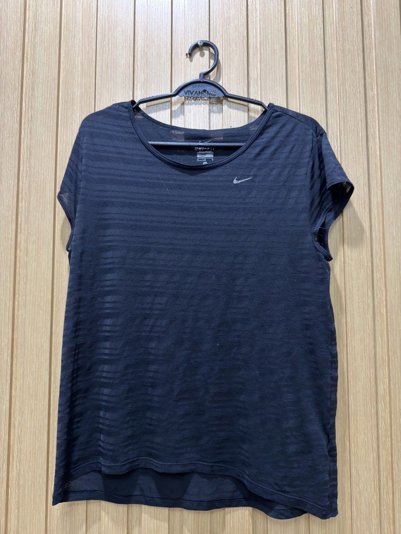 Nike Dri-FIT Black Striped Workout Top Size M (Category: Activewear) located in Bacoor. Submitted by preloved_with_love_ (Listing ID 1467609166, Image 1). Description: - Brand: Nike - Style: Dri-FIT athletic top with horizontal stripes - Size: Medium (Made in Sri Lanka) - Material: Lightweight and slightly sheer fabric - Design: Scoop neckline, short sleeves, curved hem, and iconic Nike swoosh logo - Condition: Excellent, pre-loved/new - Perfect 
