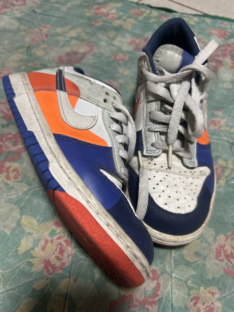 Nike Dunk Low Multi-color Size US 4.5Y (Category: Babies & Kids Fashion) located in Manila. Submitted by thrift_items_need (Listing ID 1467716609, Image 1). Description: - Brand/Model: Nike Dunk Low - Colorway: Bright multi-color (Orange, Blue, White) - Size: US 4.5Y / EUR 36.5 - Design: Standard lace-up with perforated toe box - Condition: Pre-owned with visible scuff marks on uppers, midsoles, and soles - Sole: Shows dirt and typical walking we
