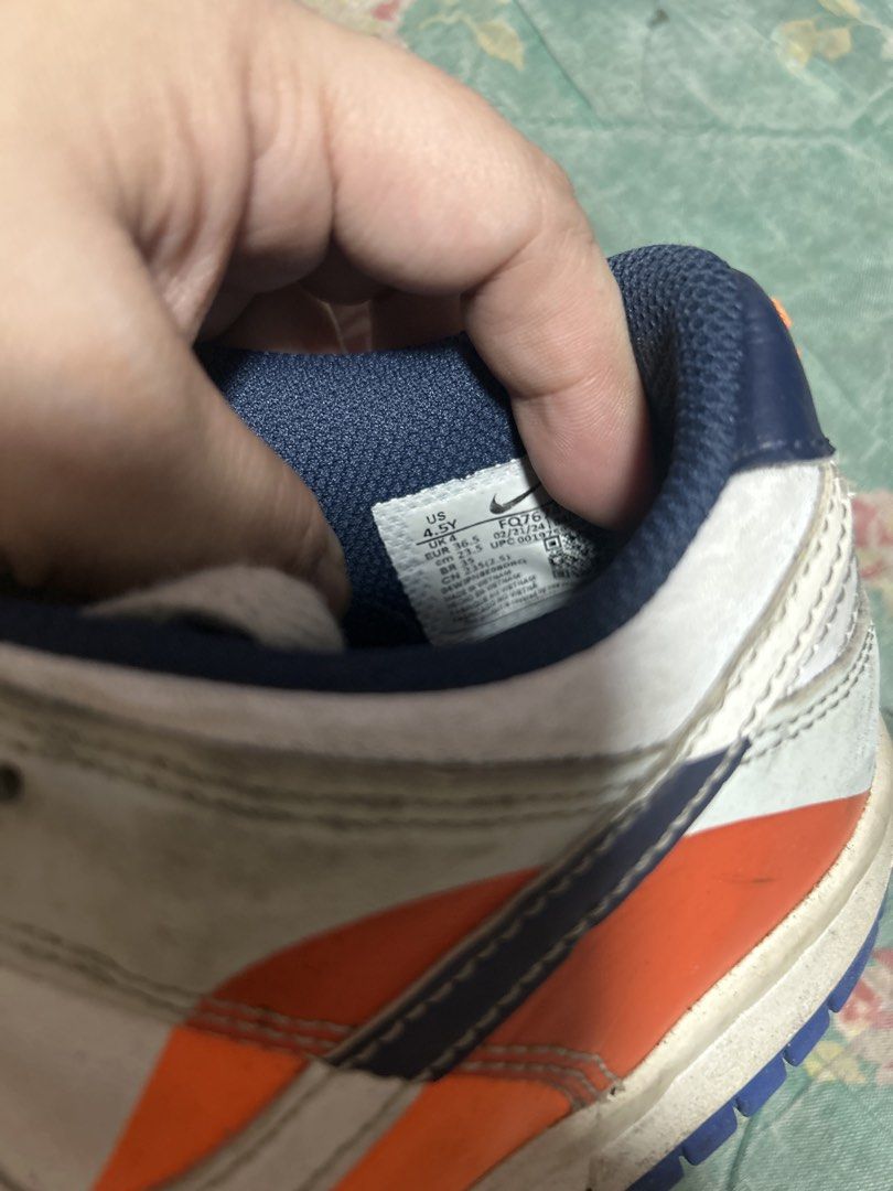 Nike Dunk Low Multi-color Size US 4.5Y (Category: Babies & Kids Fashion) located in Manila. Submitted by thrift_items_need (Listing ID 1467716609, Image 2). Description: - Brand/Model: Nike Dunk Low - Colorway: Bright multi-color (Orange, Blue, White) - Size: US 4.5Y / EUR 36.5 - Design: Standard lace-up with perforated toe box - Condition: Pre-owned with visible scuff marks on uppers, midsoles, and soles - Sole: Shows dirt and typical walking we