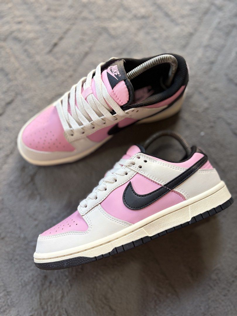 Nike Dunk Low Pink Black White Size US 7.5 (Category: Sneakers) located in Lapu Lapu. Submitted by jadegodine04736 (Listing ID 1467650093, Image 3). Description: - Model: Nike Dunk Low - Colorway: Pink, White, and Black with cream-colored laces - Size: EUR 38.5 / CM 24.5 - Design details: Low-top silhouette, classic perforated toe box, black side swooshes, and embroidered Nike heel branding - Condition: Brand new / pristine condition - Mode of pa