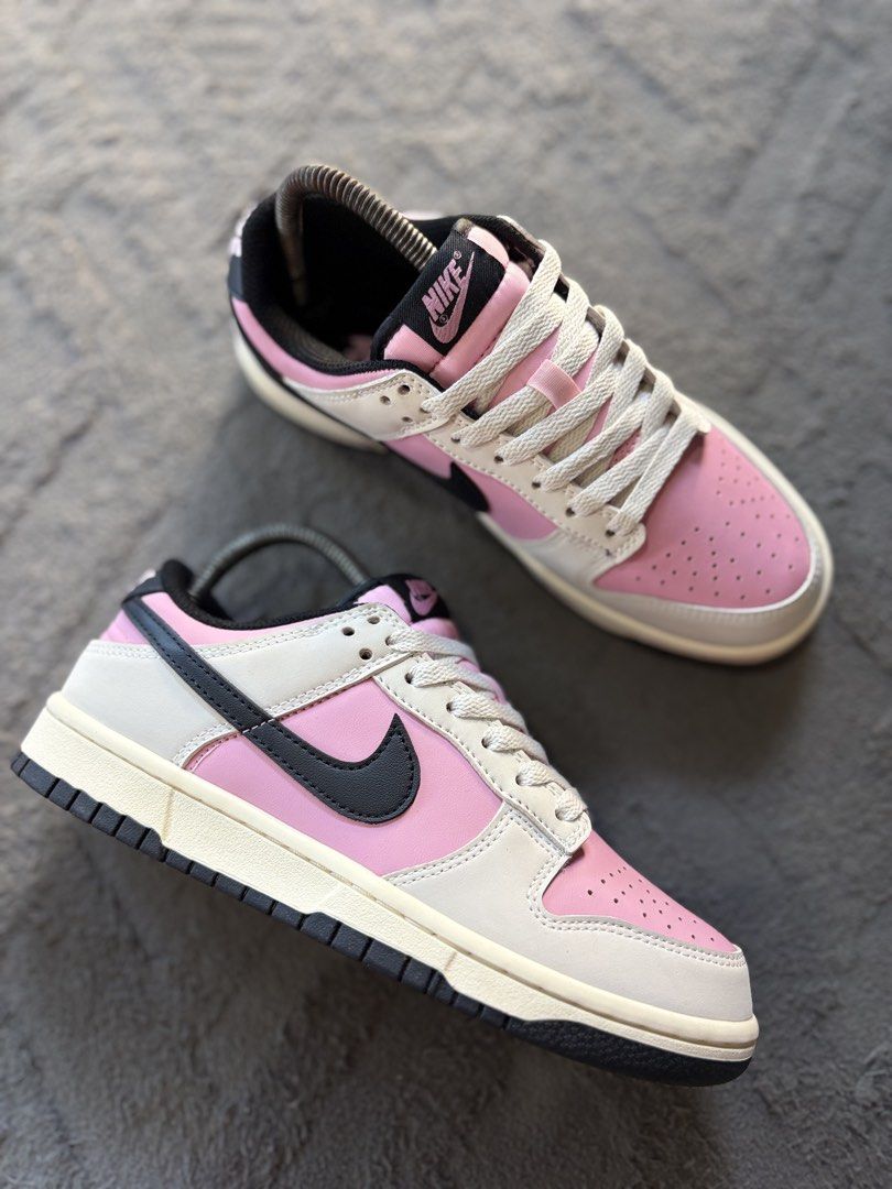 Nike Dunk Low Pink Black White Size US 7.5 (Category: Sneakers) located in Lapu Lapu. Submitted by jadegodine04736 (Listing ID 1467650093, Image 1). Description: - Model: Nike Dunk Low - Colorway: Pink, White, and Black with cream-colored laces - Size: EUR 38.5 / CM 24.5 - Design details: Low-top silhouette, classic perforated toe box, black side swooshes, and embroidered Nike heel branding - Condition: Brand new / pristine condition - Mode of pa