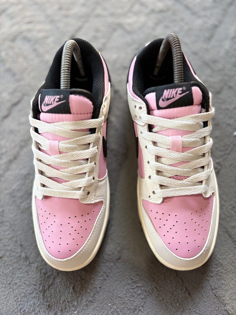 Nike Dunk Low Pink Black White Size US 7.5 (Category: Sneakers) located in Lapu Lapu. Submitted by jadegodine04736 (Listing ID 1467650093, Image 2). Description: - Model: Nike Dunk Low - Colorway: Pink, White, and Black with cream-colored laces - Size: EUR 38.5 / CM 24.5 - Design details: Low-top silhouette, classic perforated toe box, black side swooshes, and embroidered Nike heel branding - Condition: Brand new / pristine condition - Mode of pa