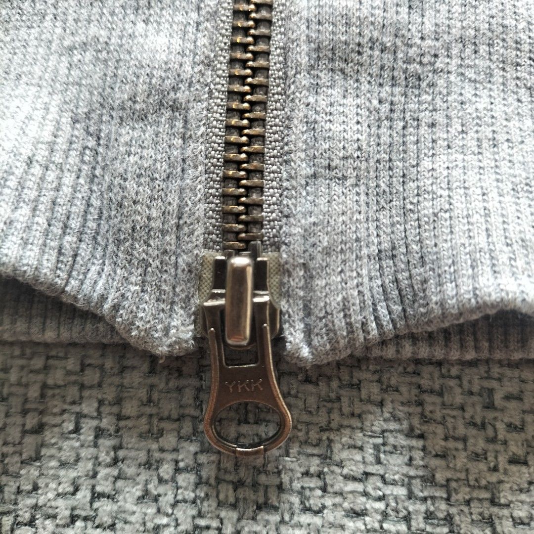 Nike Gray Velour Track Jacket Full Zip YKK (Category: Coats, Jackets and Outerwear) located in Taytay. Submitted by calmtree-6248 (Listing ID 1467637965, Image 2). Description: - Color: Gray with white piping - Material: Premium soft velour - Branding: Embroidered Nike logo on chest & small metal badge near hem - Hardware: YKK main zipper with custom round Nike zipper pull - Features: Ribbed collar, cuffs, and hem, plus two front pockets - Condit