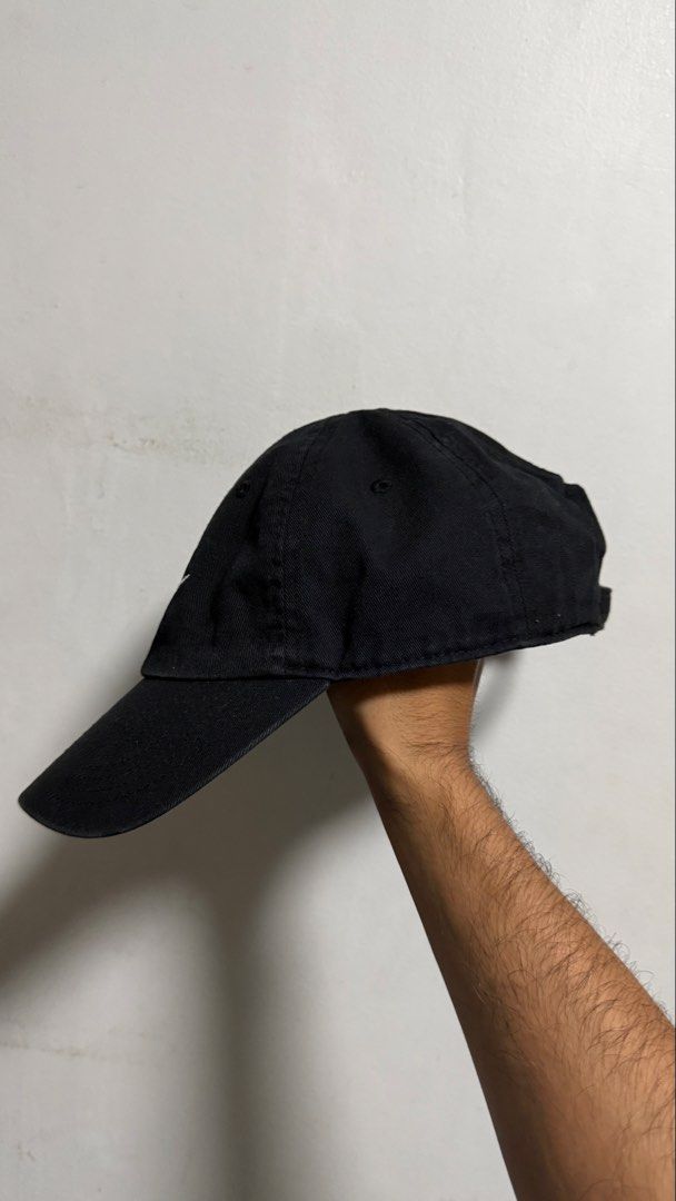 Nike Heritage 86 Black Cap (Category: Caps & Hats) located in Quezon City. Submitted by kobeeeee_12 (Listing ID 1467738358, Image 2). Description: - Brand: Nike (Heritage 86) - Color: Classic Black with White embroidered front logo - Fit: Unstructured with an adjustable metal strap (fits most sizes) - Material: 100% soft cotton inside and out - Style: Curved brim, casual everyday streetwear.