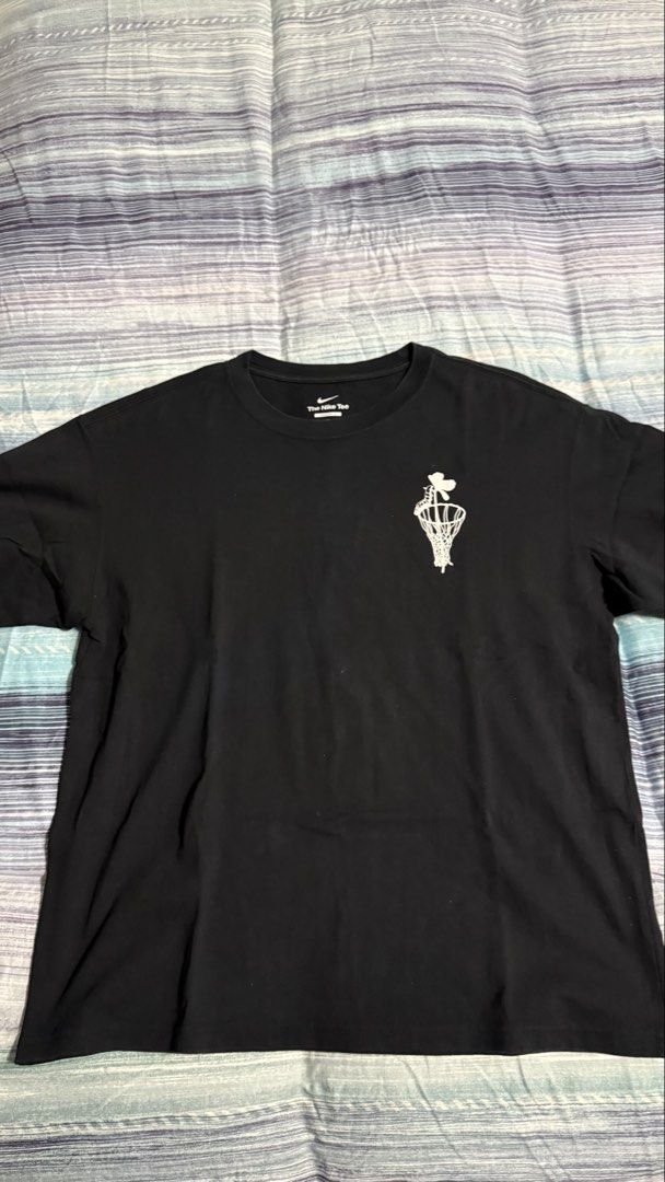 Nike Hoops Black T-Shirt Graphic Tee (Category: Tshirts & Polo Shirts ) located in Quezon City. Submitted by kobeeeee_12 (Listing ID 1467641995, Image 2). Description: - Brand: Nike (The Nike Tee) - Style: Black Hoops graphic t-shirt - Front: Small basketball net graphic on chest - Back: Large grey and green Nike Hoops text logo - Condition: Excellent / Pre-loved - Shipping or meetup options available.