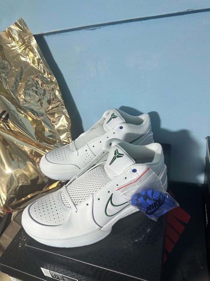 Nike Kobe 4 Protro White Green Blue (Category: Sneakers) located in Manila. Submitted by linomer (Listing ID 1467825409, Image 3). Description: - Model: Nike Kobe 4 Protro - Colorway: White with Green Swoosh - Size: US 12 - Condition: Brand new, clean uppers, fresh out of the packaging - Details: Numbers 8 and 24 embroidered on the heels - Includes: Original box and extra blue laces.