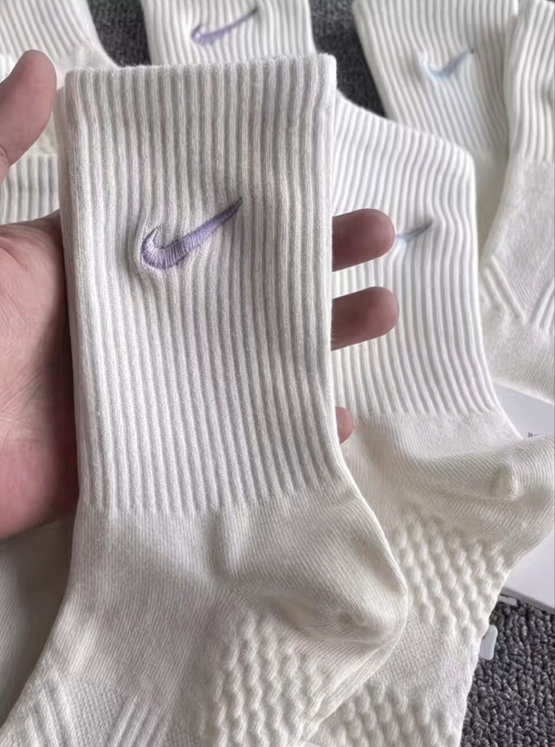Nike Lightweight Performance Cotton Socks Multi-color Swoosh (Category: Activewear) located in Quezon City. Submitted by thelittlebutterflyshop (Listing ID 1467664698, Image 3). Description: -pre-order -5 random pairs -PM for inquiry - Brand new with tags (BNWT) - Color: Crisp white with embroidered pastel swoosh logos - Material: Comfortable performance cotton - Design: Ribbed top with a breathable textured weave underneath - Versatility: Perfec