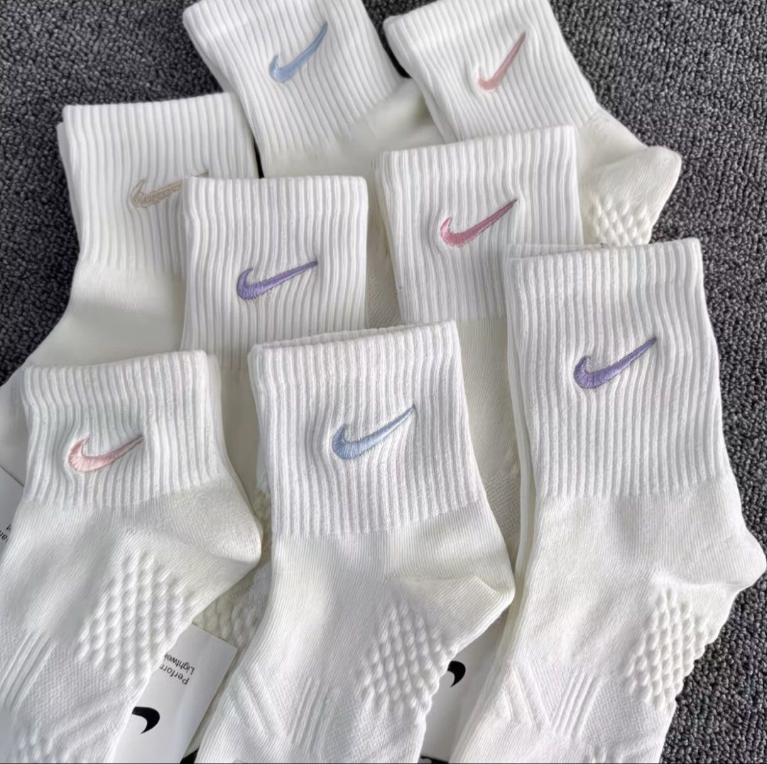 Nike Lightweight Performance Cotton Socks Multi-color Swoosh (Category: Activewear) located in Quezon City. Submitted by thelittlebutterflyshop (Listing ID 1467664698, Image 1). Description: -pre-order -5 random pairs -PM for inquiry - Brand new with tags (BNWT) - Color: Crisp white with embroidered pastel swoosh logos - Material: Comfortable performance cotton - Design: Ribbed top with a breathable textured weave underneath - Versatility: Perfec