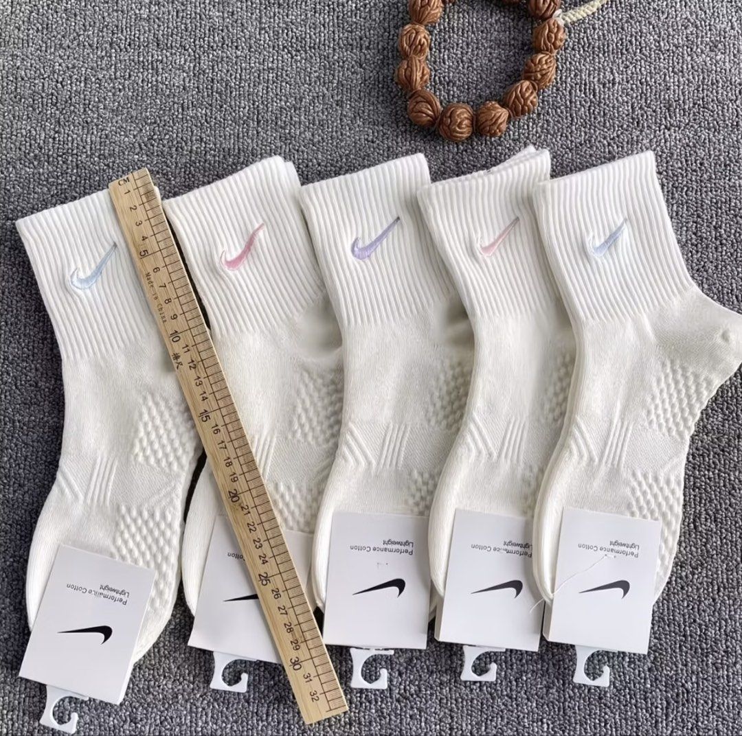 Nike Lightweight Performance Cotton Socks Multi-color Swoosh (Category: Activewear) located in Quezon City. Submitted by thelittlebutterflyshop (Listing ID 1467664698, Image 2). Description: -pre-order -5 random pairs -PM for inquiry - Brand new with tags (BNWT) - Color: Crisp white with embroidered pastel swoosh logos - Material: Comfortable performance cotton - Design: Ribbed top with a breathable textured weave underneath - Versatility: Perfec
