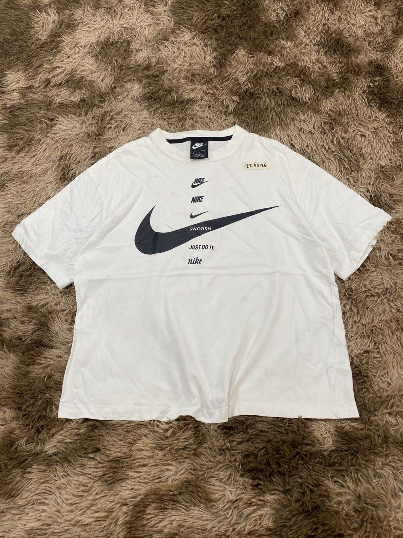 Nike Multi Logo White T-Shirt (Category: Tshirts & Polo Shirts ) located in Cagayan de Oro. Submitted by sepamorash53558 (Listing ID 1467643702, Image 1). Description: - Brand: Nike - Color: White - Material: 100% Cotton - Size: L (Chest 90cm) - Measurements: 22.5" pit-to-pit, 26" length - Design: Stacked logo and swoosh graphic on chest - Fit: Standard fit, casual streetwear - Origin: Made in China.