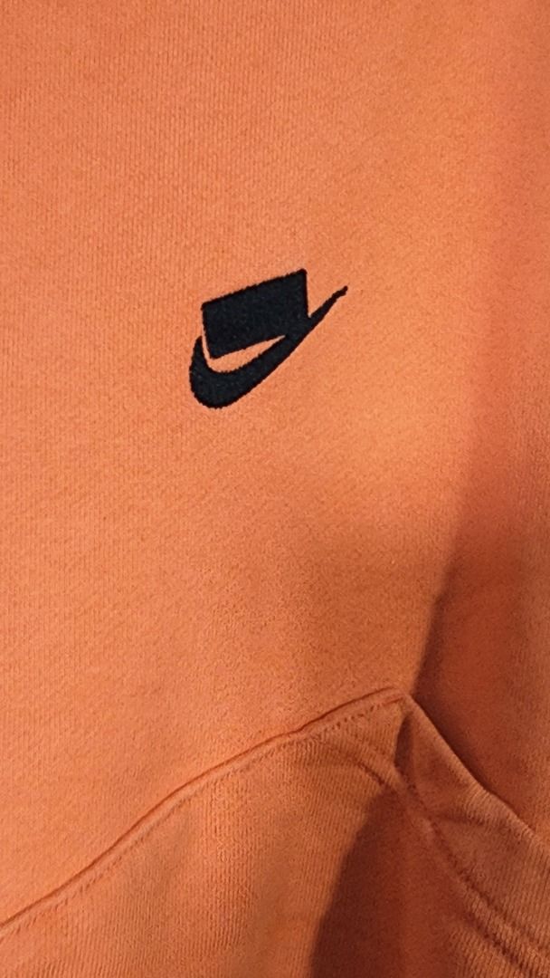 Nike Orange Patchwork Hoodie Size M (Category: Coats, Jackets and Outerwear) located in Baguio. Submitted by genesisomega (Listing ID 1467647553, Image 2). Description: - Brand/Model: Nike Hoodie - Color: Bright Orange - Size: Medium - Large - Features: Unique patchwork detailing on front and sleeves, black embroidered chest logo - Interior: Comfortable fleece fabric - Details: Standard front pocket, ribbed cuffs and hem - Origin: Made in China -