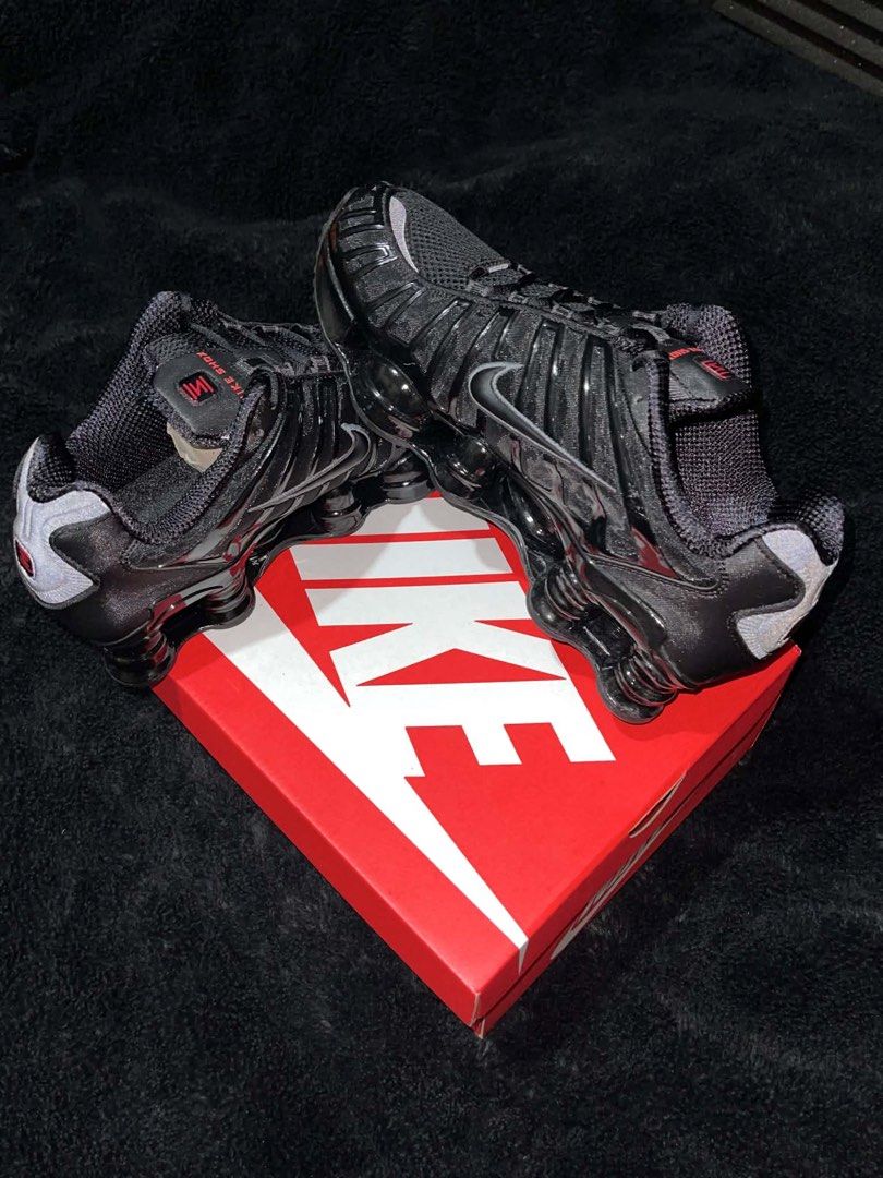 Nike Shox TL Black Metallic Hematite (Category: Sneakers) located in Tanza. Submitted by ice.caballero (Listing ID 1467762068, Image 3). Description: - Model: Nike Shox TL - item serial # AV3595-002 - Colorway: Triple Black with metallic silver details and bold red branding - Condition: Deadstock, tried on in house only - Features: Iconic full-length Shox columns for maximum cushioning, breathable mesh upper with glossy cage overlays - Inclusions
