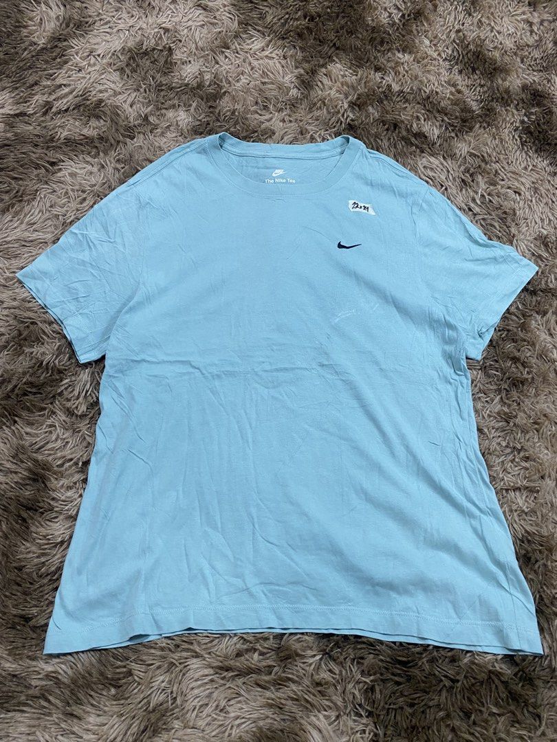 Nike The Nike Tee Light Blue XXL (Category: Tshirts & Polo Shirts ) located in Cagayan de Oro. Submitted by sepamorash53558 (Listing ID 1467642885, Image 1). Description: - Brand: Nike (The Nike Tee) - Size: XXL (Tag: 110cm chest) - Color: Light blue - Material: 100% cotton (Made in Turkey) - Design: Classic embroidered swoosh logo on the chest - Style: Crew neck, soft material - Flat Lay Measurements: 22 inches (width) x 29 inches (length).