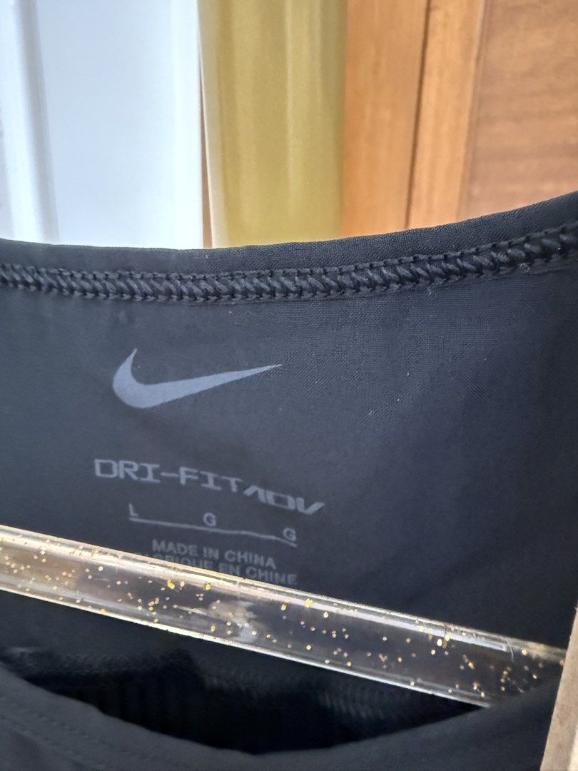 Nike: Top in Black (Category: Activewear) located in Quezon City. Submitted by vpauline (Listing ID 1467627403, Image 2). Description: with tag.