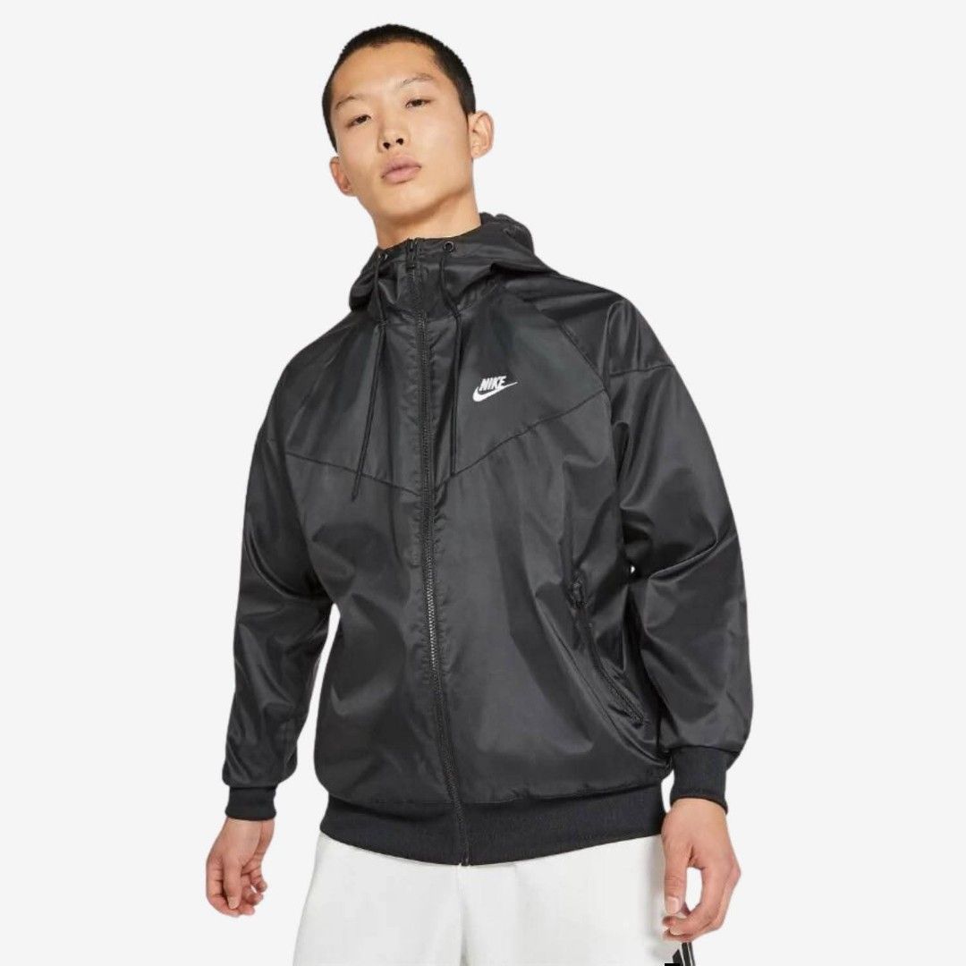 Nike Windrunner Black Hooded Jacket (Category: Coats, Jackets and Outerwear) located in Meycauayan. Submitted by livastrid (Listing ID 1467650755, Image 1). Description: - Brand: Nike - Color: Classic Black with White Logo - Style: Windbreaker jacket with full zip closure and matching hood - Design: Iconic chevron pattern across chest and back - Storage: Secure zippered pockets for essentials - Comfort: Ribbed cuffs and hem to lock in warmth - Ma