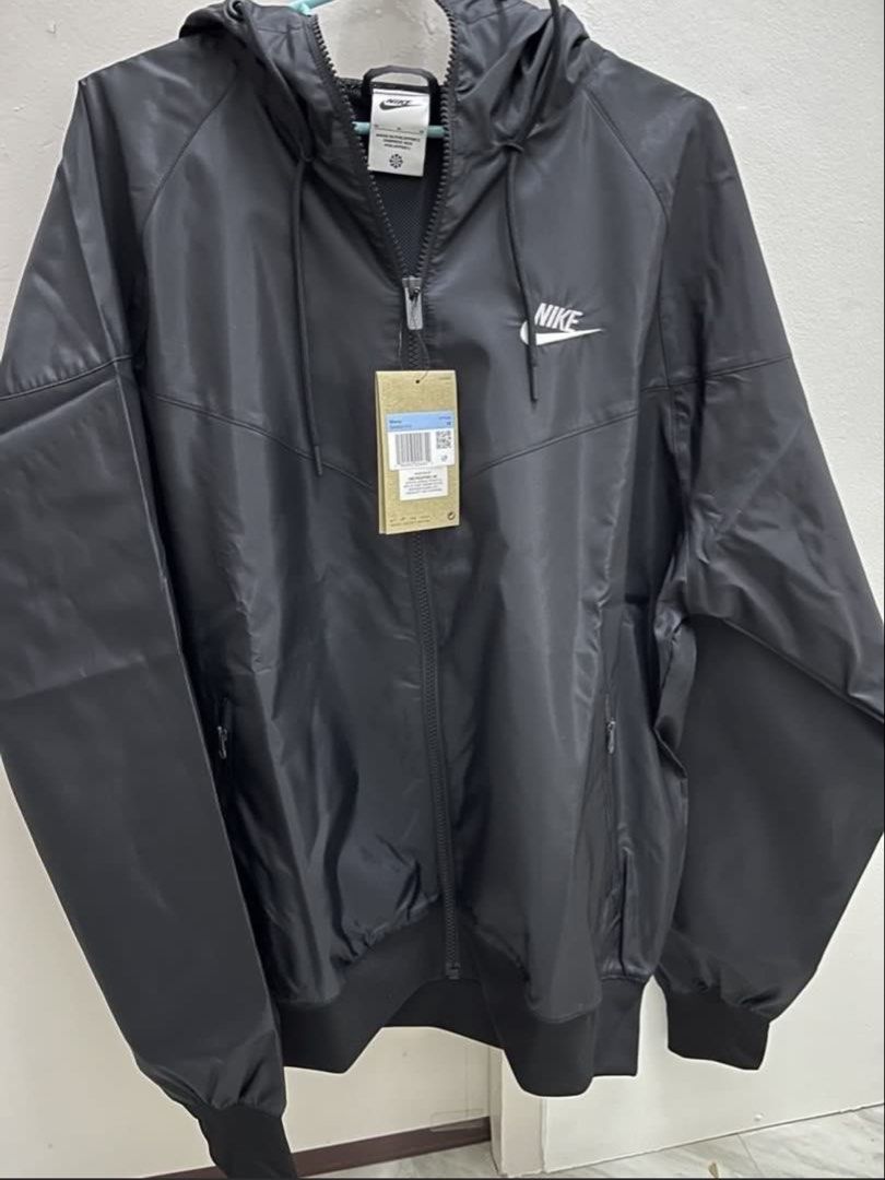 Nike Windrunner Black Jacket Size M (Category: Coats, Jackets and Outerwear) located in Meycauayan. Submitted by ranastridran (Listing ID 1467608362, Image 1). Description: - Brand: Nike - Model: The Windrunner - Color: Black - Size: Men's Medium - Condition: Brand new with original store hang tag attached - Features: Hood with drawstring, full zip front, zipped side pockets, and ribbed cuffs/hem.