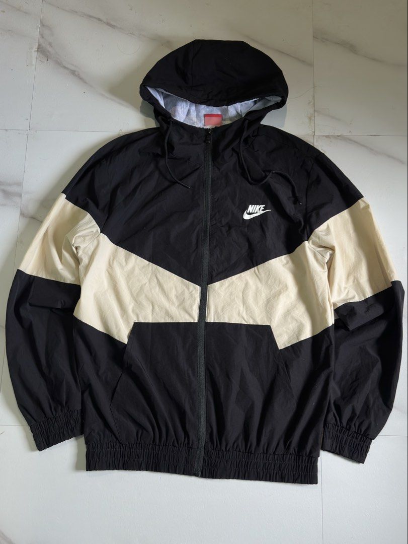Nike Windrunner Jacket Black White Colorblock (Category: Coats, Jackets and Outerwear) located in Cavite. Submitted by remcadzzz (Listing ID 1467672984, Image 1). Description: - Brand: Nike - Style: Windrunner Colorblock Jacket (Black & Cream Beige) - Details: Full zip with branded pull, adjustable drawstring hood, elastic cuffs and hem - Branding: Embroidered white Nike logo on chest, large black swoosh graphic on back - Lining: Breathable mesh 