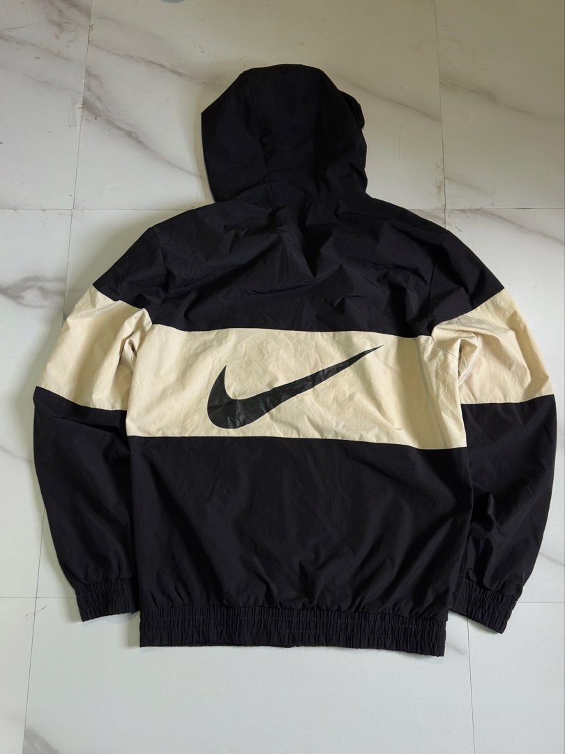 Nike Windrunner Jacket Black White Colorblock (Category: Coats, Jackets and Outerwear) located in Cavite. Submitted by remcadzzz (Listing ID 1467672984, Image 3). Description: - Brand: Nike - Style: Windrunner Colorblock Jacket (Black & Cream Beige) - Details: Full zip with branded pull, adjustable drawstring hood, elastic cuffs and hem - Branding: Embroidered white Nike logo on chest, large black swoosh graphic on back - Lining: Breathable mesh 