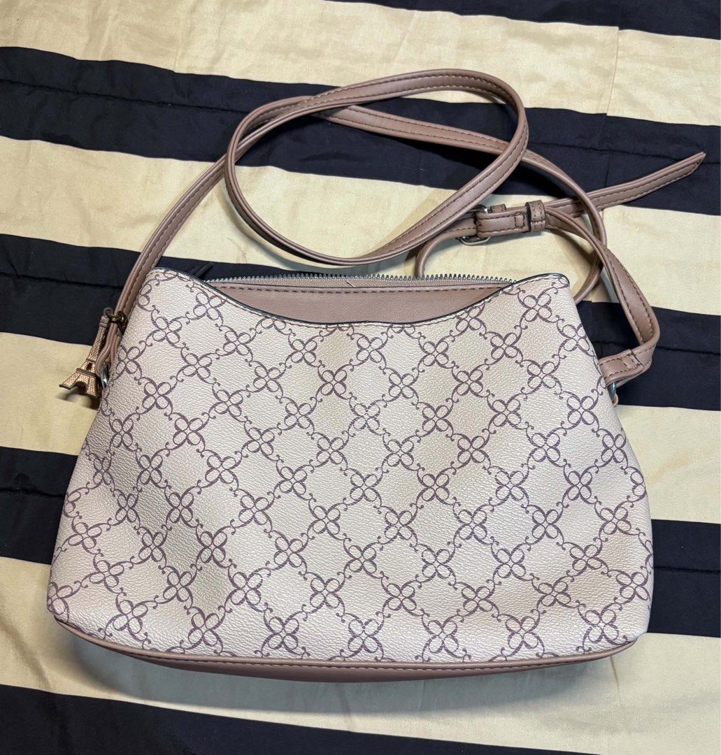 Nine West Monogram Crossbody Bag (Category: Cross-body Bags) located in Pasay City. Submitted by faye_xoxo (Listing ID 1467732114, Image 2). Description: - ORIGINAL Nine West Bag - NO FLAWS! Barely used - Classic beige and brown monogram pattern RFS: Need funds for my Grandma No flaws, wag na po baratin please..