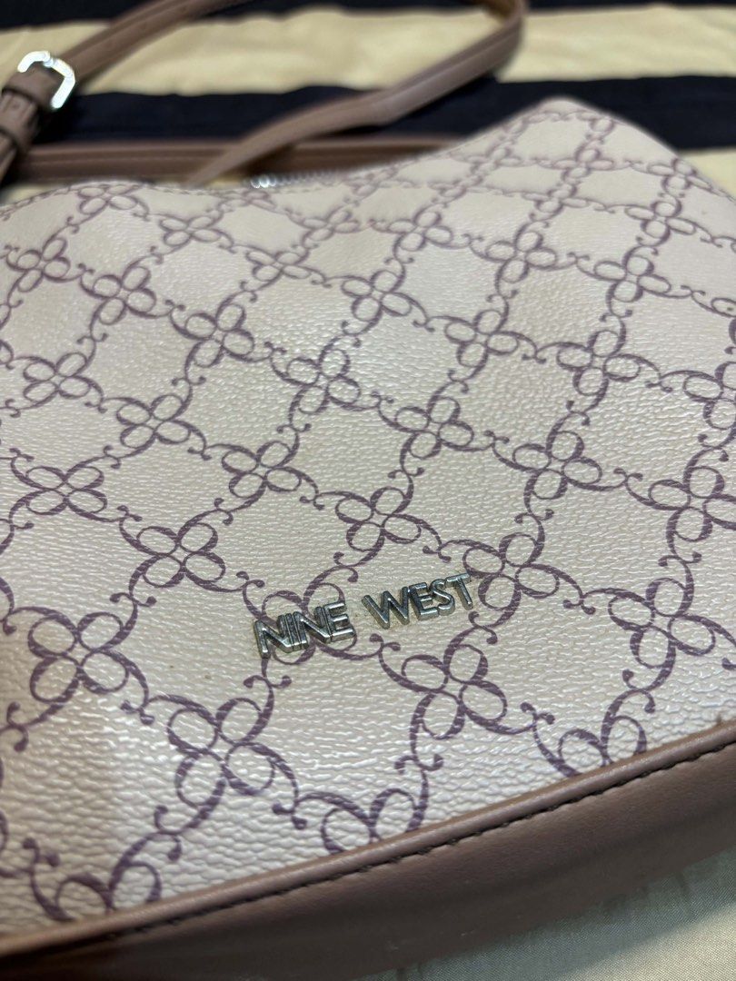 Nine West Monogram Crossbody Bag (Category: Cross-body Bags) located in Pasay City. Submitted by faye_xoxo (Listing ID 1467732114, Image 3). Description: - ORIGINAL Nine West Bag - NO FLAWS! Barely used - Classic beige and brown monogram pattern RFS: Need funds for my Grandma No flaws, wag na po baratin please..