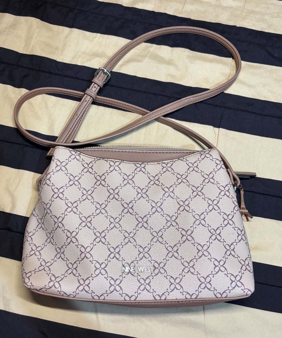 Nine West Monogram Crossbody Bag (Category: Cross-body Bags) located in Pasay City. Submitted by faye_xoxo (Listing ID 1467732114, Image 1). Description: - ORIGINAL Nine West Bag - NO FLAWS! Barely used - Classic beige and brown monogram pattern RFS: Need funds for my Grandma No flaws, wag na po baratin please..