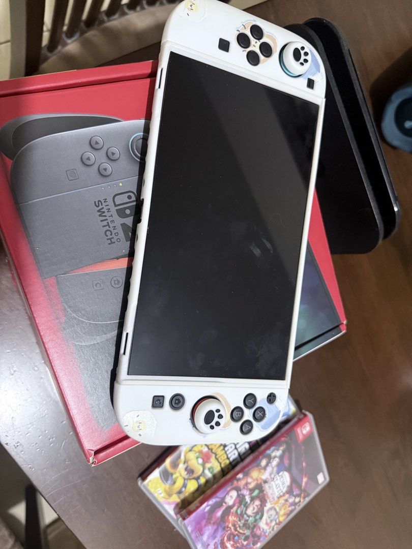 Nintendo Switch Console and Tomodachi Game (Category: Nintendo) located in Taguig. Submitted by tricebea (Listing ID 1467712334, Image 2). Description: - Nintendo Switch 2 Console with Tomodachi item - Purchased directly from DataBlitz on June 18, 2026 (Original sales invoice included) - Total store retail price: ₱38,964.80 - 100% fresh, unused, and pristine condition straight from the store - RFS: Extra unit / Need gone ASAP - Meetups and shippi