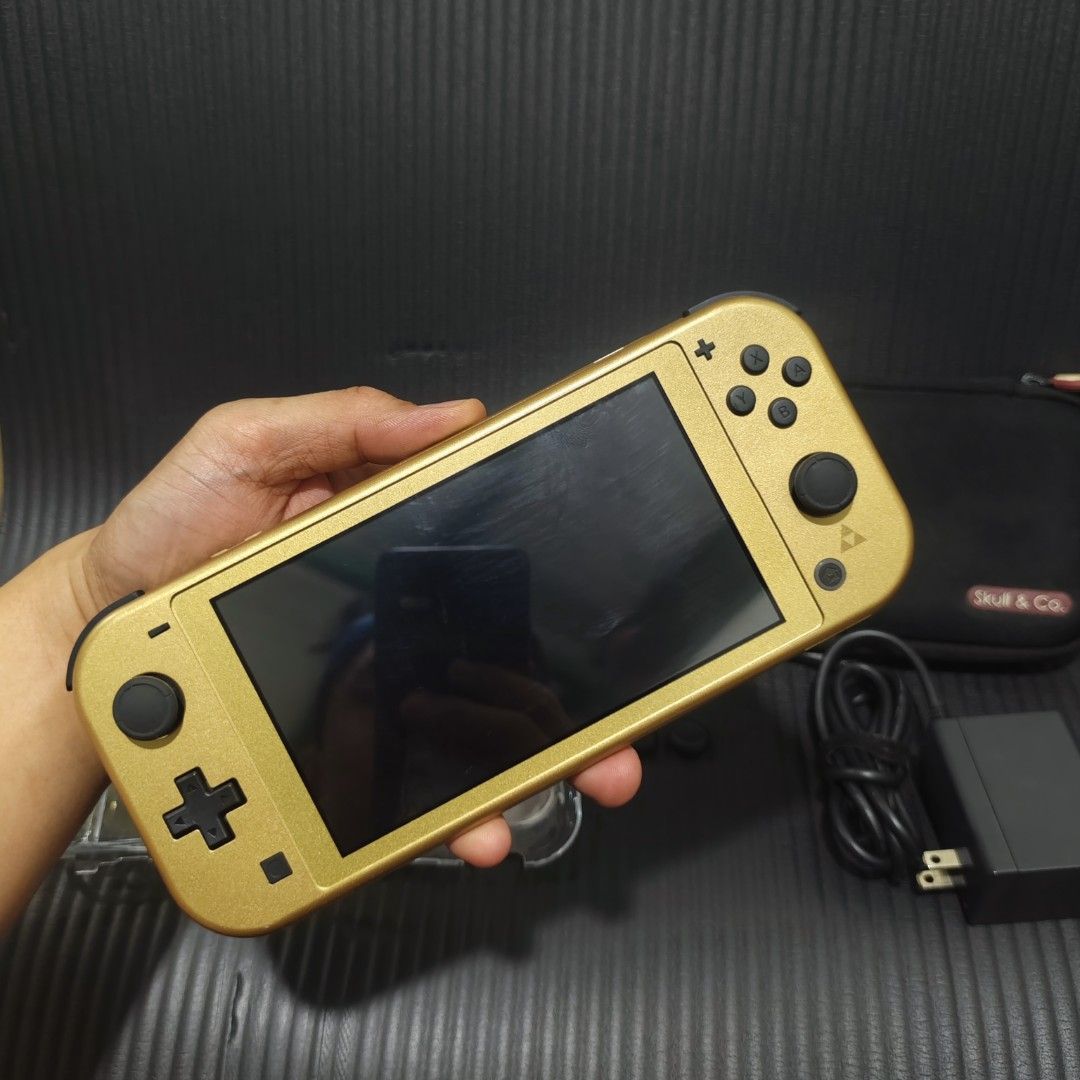 Nintendo Switch Lite Hyrule limited edition (Unit Only) (Category: Nintendo) located in Quezon City. Submitted by shopme_gadget30 (Listing ID 1467741033, Image 2). Description: kindly read the details first for sale fixed price 8.5/10 good Condition no issue excellent performance no drifting all buttons working latest firmware non modded No Games No Sd Card No Box inclusion Console Original charger pouch bag skull & Co clear case thumb grip qc ar