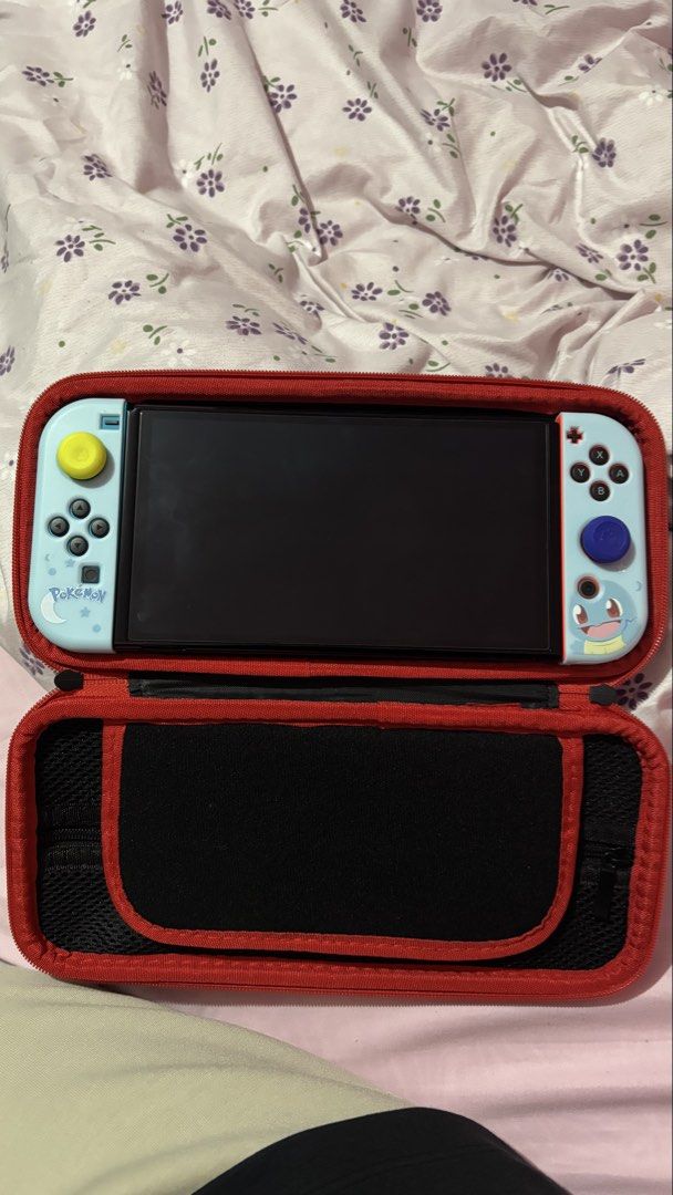 Nintendo Switch OLED with Pokemon Squirtle Grips (Category: Nintendo) located in Quezon City. Submitted by aistar (Listing ID 1467731557, Image 1). Description: 🎮 FOR SALE: Nintendo Switch OLED + Physical Zelda Game 🎮 Selling my Nintendo Switch OLED in excellent condition. Barely used and well taken care of. Perfect for anyone looking for a Nintendo Switch at a great price 💖 ✨ Inclusions: * Nintendo Switch OLED unit * Original Nintendo dock * 