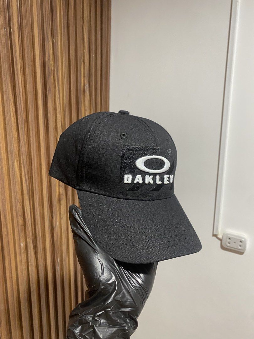 Oakley Black Hat Cap with Tag (Category: Caps & Hats) located in Caloocan City. Submitted by heatedcaps4425 (Listing ID 1467801368, Image 2). Description: - Brand: Oakley - Color: Classic Black - Material: Durable ripstop fabric - Design: White embroidered logo and patch on the front - Closure: Adjustable metal strap at the back - Condition: Brand new with original interior hang tag attached.